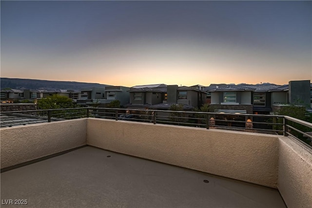 view of balcony at dusk