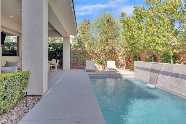 view of pool featuring a patio and pool water feature