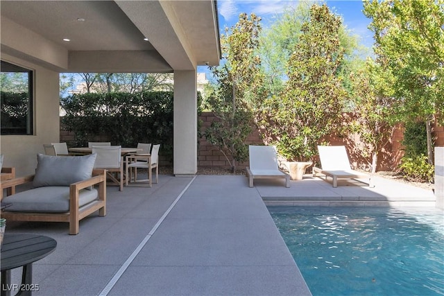 view of pool featuring a patio area