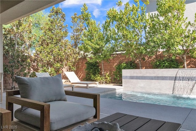 view of patio featuring pool water feature