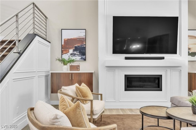 sitting room with hardwood / wood-style floors