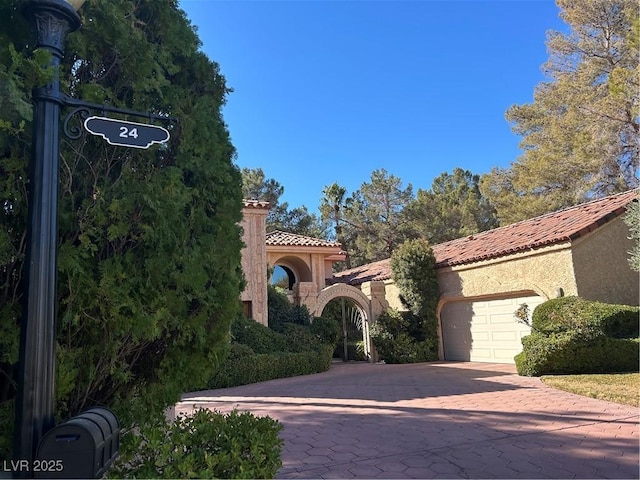 mediterranean / spanish-style home featuring a garage