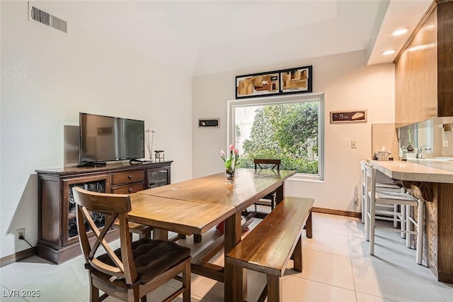 tiled dining area with sink