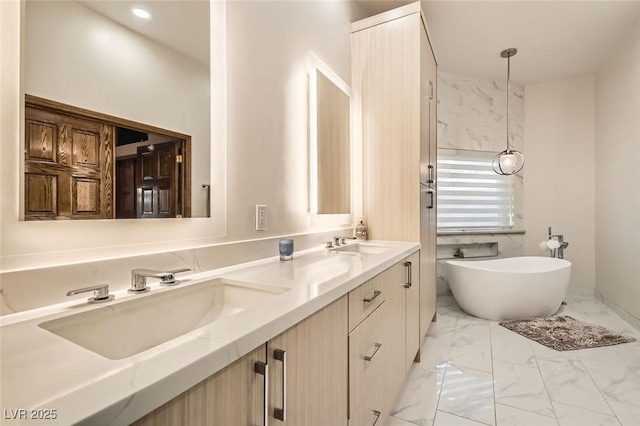 bathroom with vanity and a tub to relax in