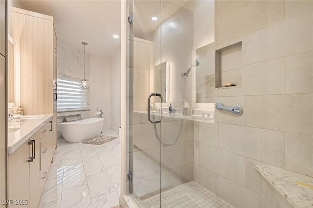 bathroom featuring vanity and separate shower and tub