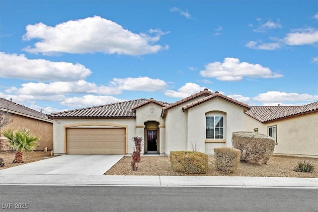 mediterranean / spanish-style home featuring a garage