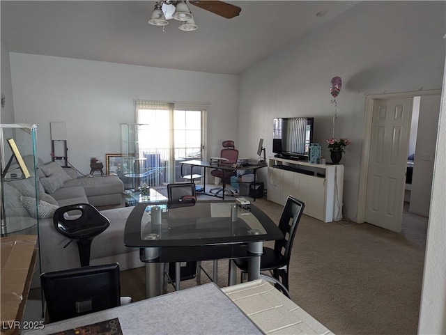 living room featuring ceiling fan, light carpet, and lofted ceiling