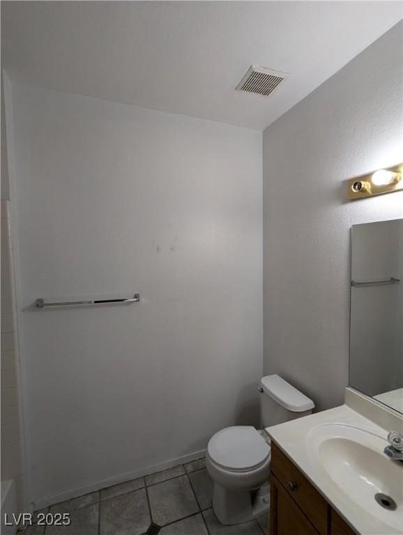 10524 Pine Gardens Ct Unit 203, Las Vegas, NV 89144 - bathroom with vanity, tile patterned floors, toilet, baseboards, and a bath