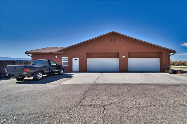 ranch-style house featuring a garage