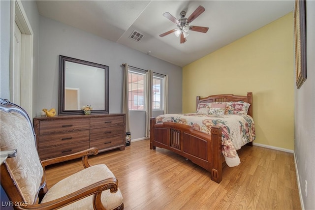 bedroom featuring ceiling fan, lofted ceiling, and light hardwood / wood-style floors