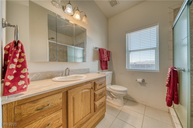 bathroom with vanity, toilet, a shower with shower door, and tile patterned flooring