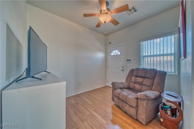 sitting room featuring ceiling fan and light hardwood / wood-style flooring