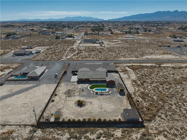 birds eye view of property featuring a mountain view