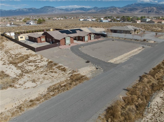 birds eye view of property with a mountain view