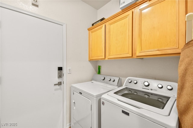 laundry room with cabinets and washing machine and dryer