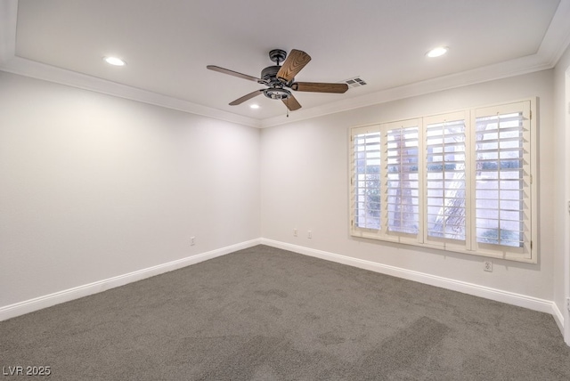 empty room with crown molding, ceiling fan, and carpet flooring