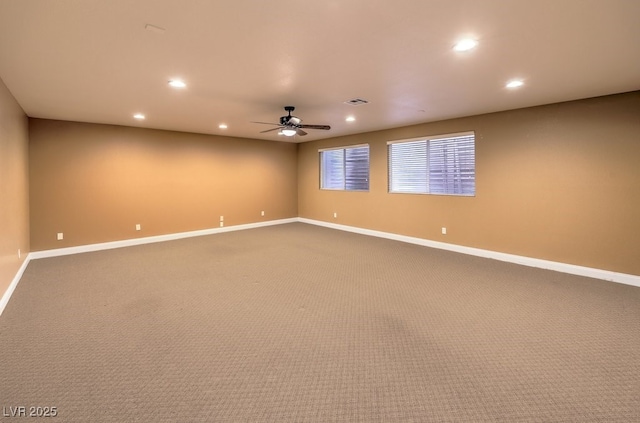 empty room with ceiling fan and carpet flooring