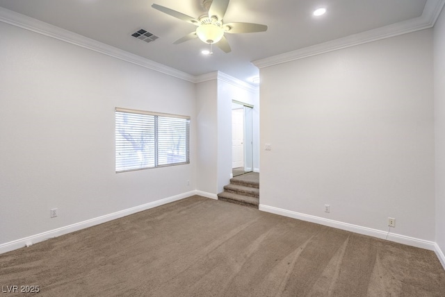 carpeted empty room featuring crown molding and ceiling fan