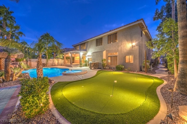 view of pool with an in ground hot tub