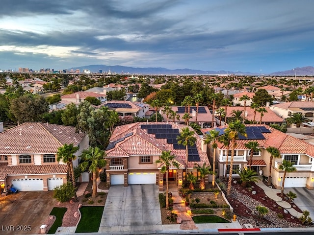 birds eye view of property featuring a mountain view