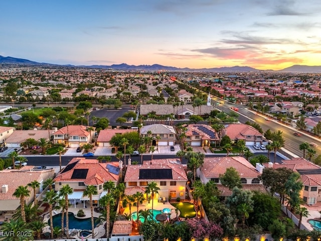 aerial view at dusk with a mountain view