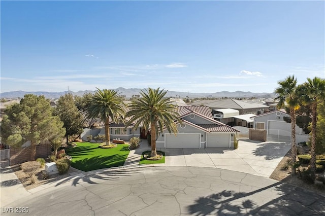 view of front facade featuring a mountain view and a front lawn