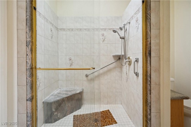 bathroom with a tile shower