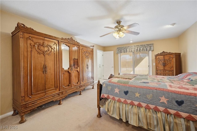 carpeted bedroom featuring access to exterior and ceiling fan