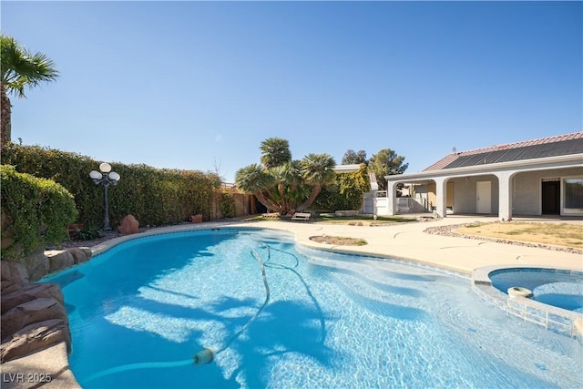 view of swimming pool featuring a patio area