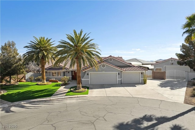 view of front of property featuring a garage and a front yard