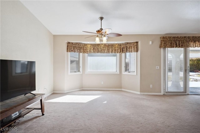 unfurnished living room featuring light carpet and ceiling fan