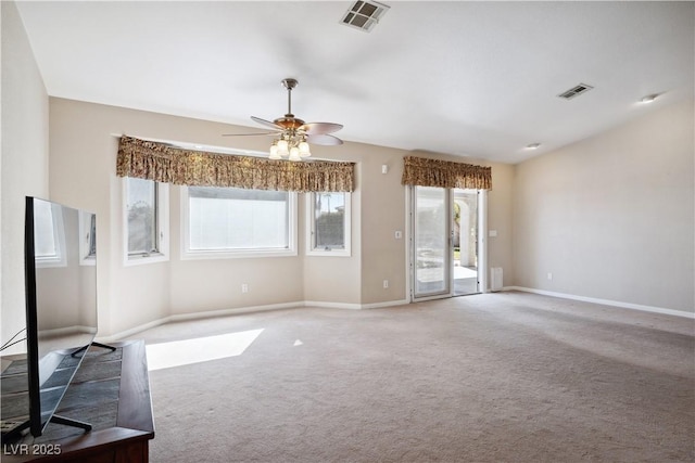 unfurnished living room with ceiling fan and carpet flooring