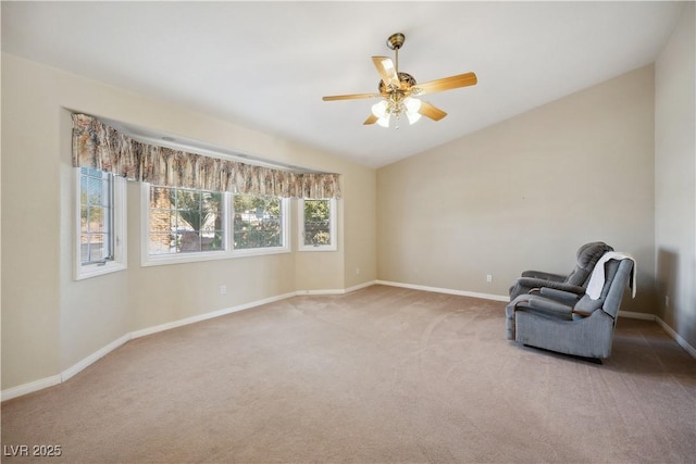 unfurnished room featuring ceiling fan, light colored carpet, and vaulted ceiling