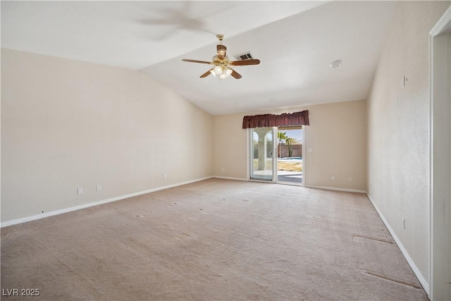 carpeted empty room featuring ceiling fan and vaulted ceiling