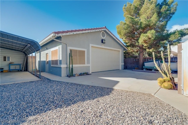 view of front of house featuring a garage and a carport