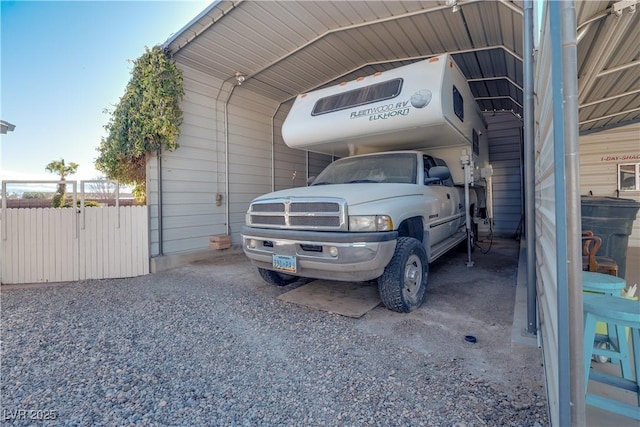 view of parking / parking lot featuring a carport