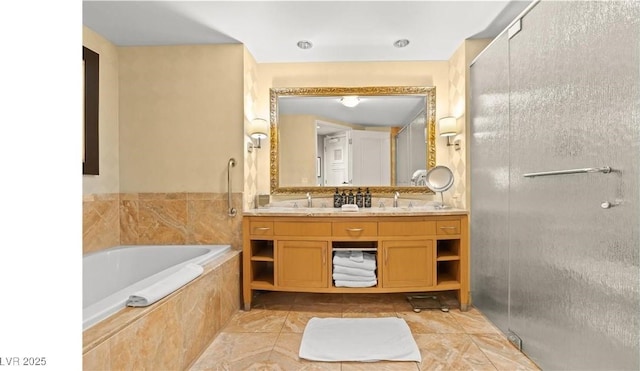 bathroom with vanity, tile patterned floors, and tiled bath