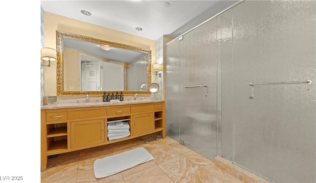 bathroom with walk in shower and vanity