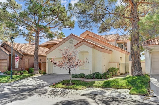 mediterranean / spanish-style home featuring a garage