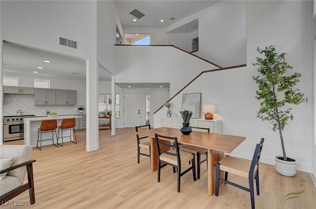 dining space with light hardwood / wood-style floors