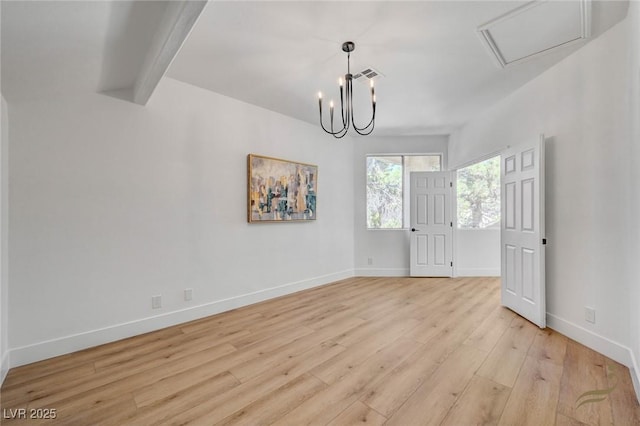 empty room with a notable chandelier, light hardwood / wood-style flooring, and beamed ceiling