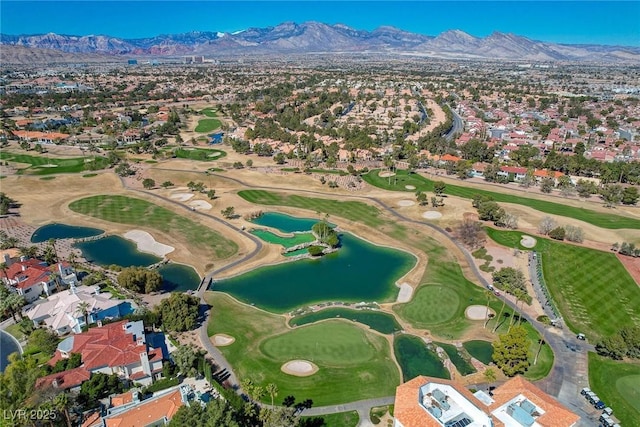 drone / aerial view featuring a water and mountain view