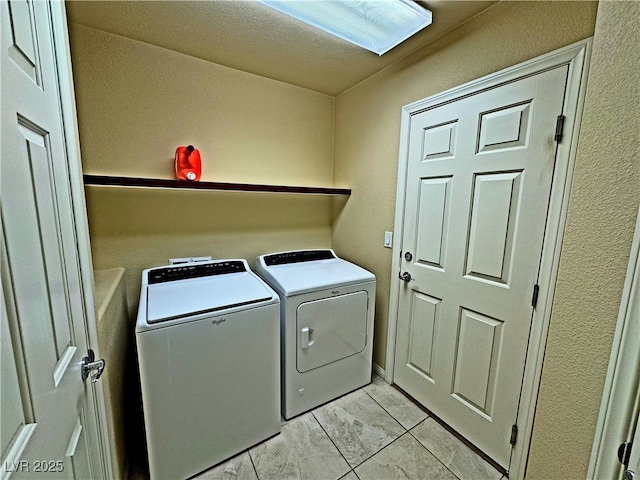 laundry room featuring washing machine and clothes dryer