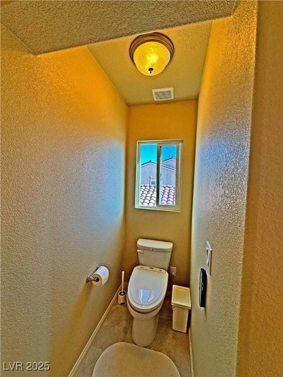 bathroom featuring toilet