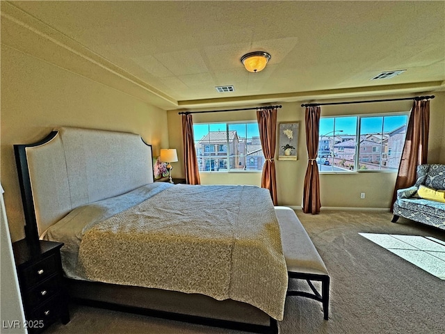 carpeted bedroom featuring multiple windows