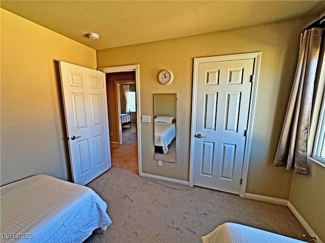 bedroom featuring light colored carpet