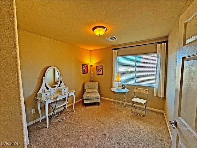 sitting room with carpet flooring