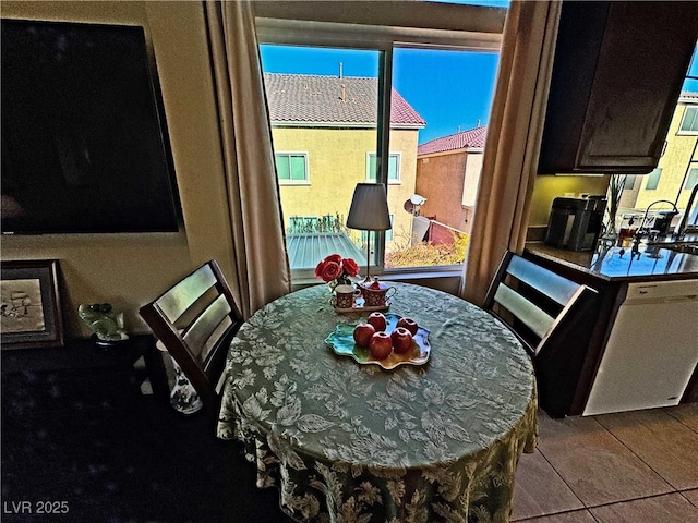 dining area featuring light tile patterned floors