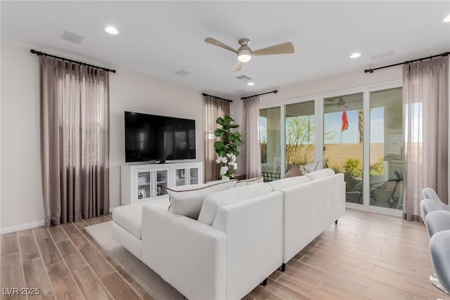 living room with ceiling fan