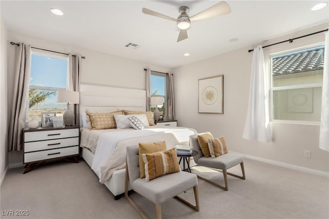 bedroom featuring light carpet and ceiling fan